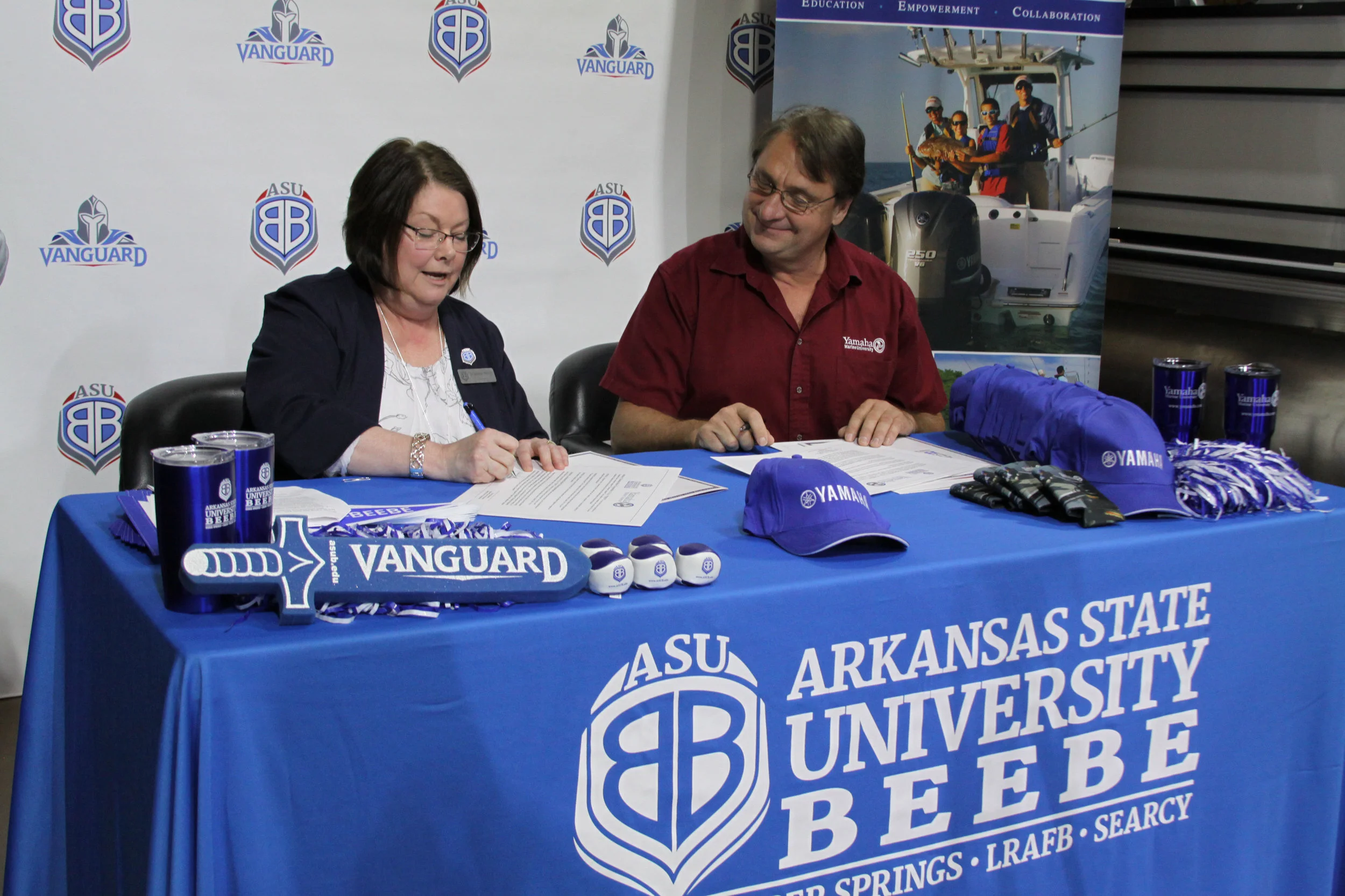 Dr. Jennifer Methvin, chancellor of ASU-Beebe and Steve Maciosek, regional service manager for Yamaha Motor Corporation, U.S.A. sign the agreement establishing the Yamaha Outboard Service Technician training program at ASU-Beebe’ s Searcy campus on Wednesday, July 17, 2019. The program will create a career track to become a Yamaha certified Marine Master Service Technician. (Photo courtesy ASU-Beebe) .