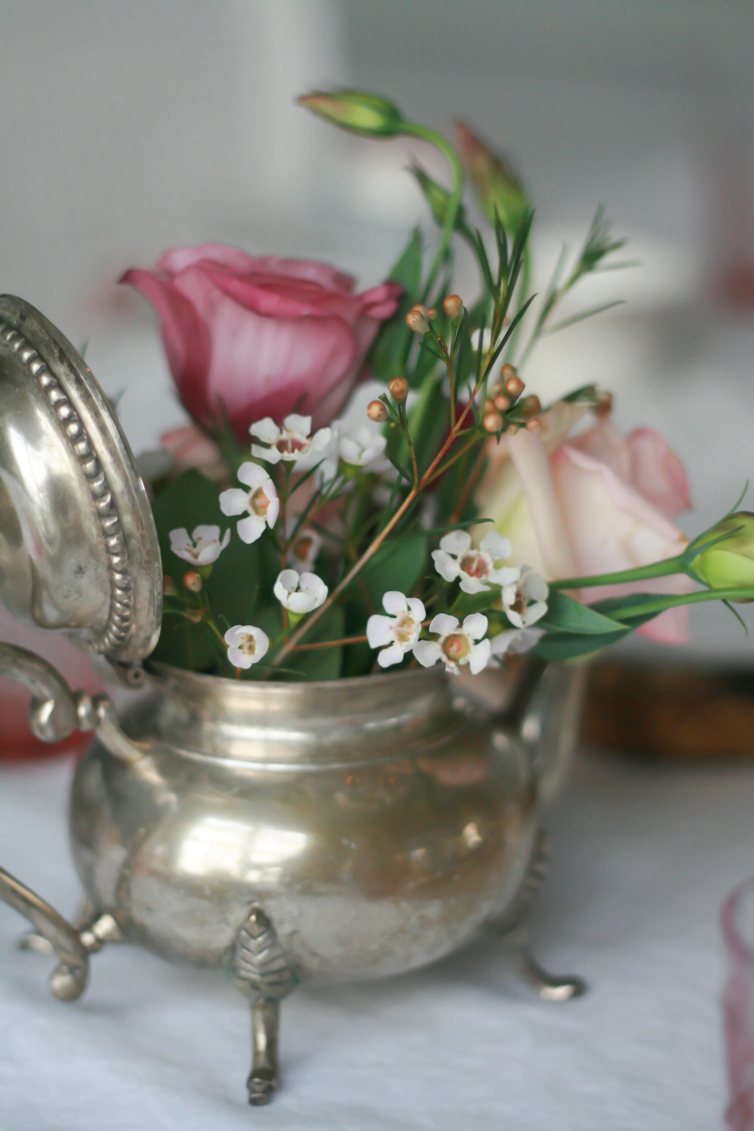 I ordered some old silver teapots from Etsy and filled them with fresh flowers.