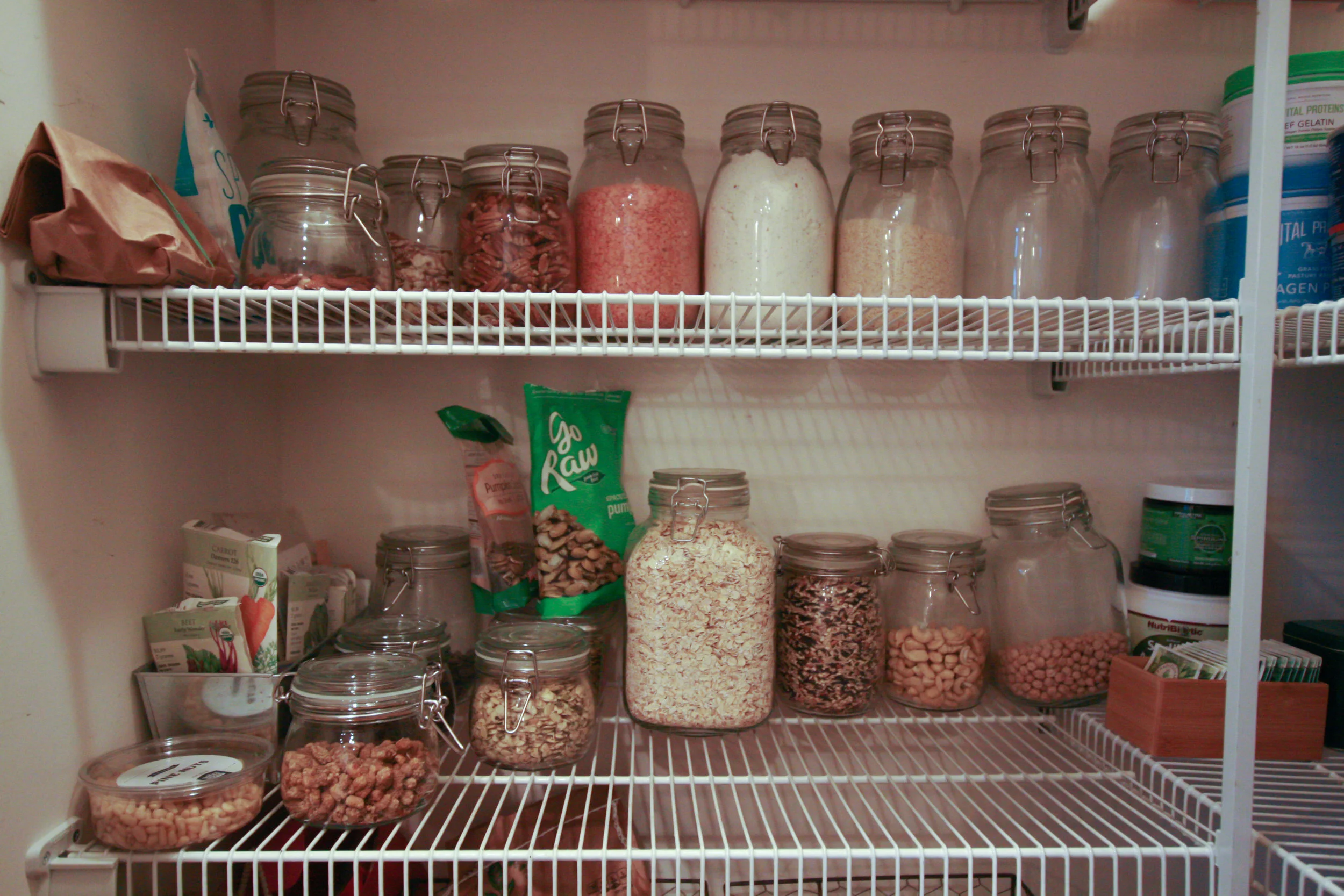 Some things in the photo not on the above list are dried mulberries (short jar in foreground), dried garbanzoes (back big jar), spirulina (green container), and sodium ascorbate (below the green container)