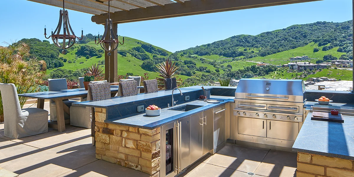 Pictured: Landscape Architect Terry Camp worked collaboratively with this Orinda couple and their landscape team to turn their backyard wishes into a reality. This kitchen was designed by Camp and Camp with serious entertaining in mind. The expansive backyard features a fully independent outdoor kitchen with an all-Kalamazoo product lineup, requested for its design flexibility, performance and superior features. To go behind the design of this scenic outdoor space, read more in: Kalamazoo Gourmet .