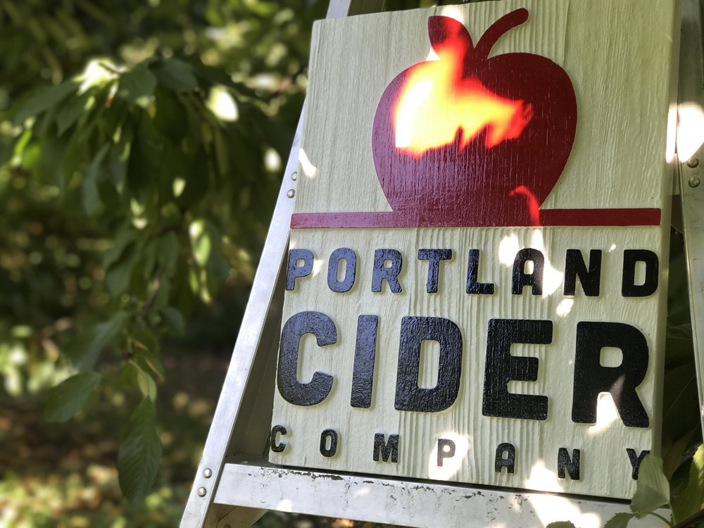 Portland Cider logo in apple orchard.JPG