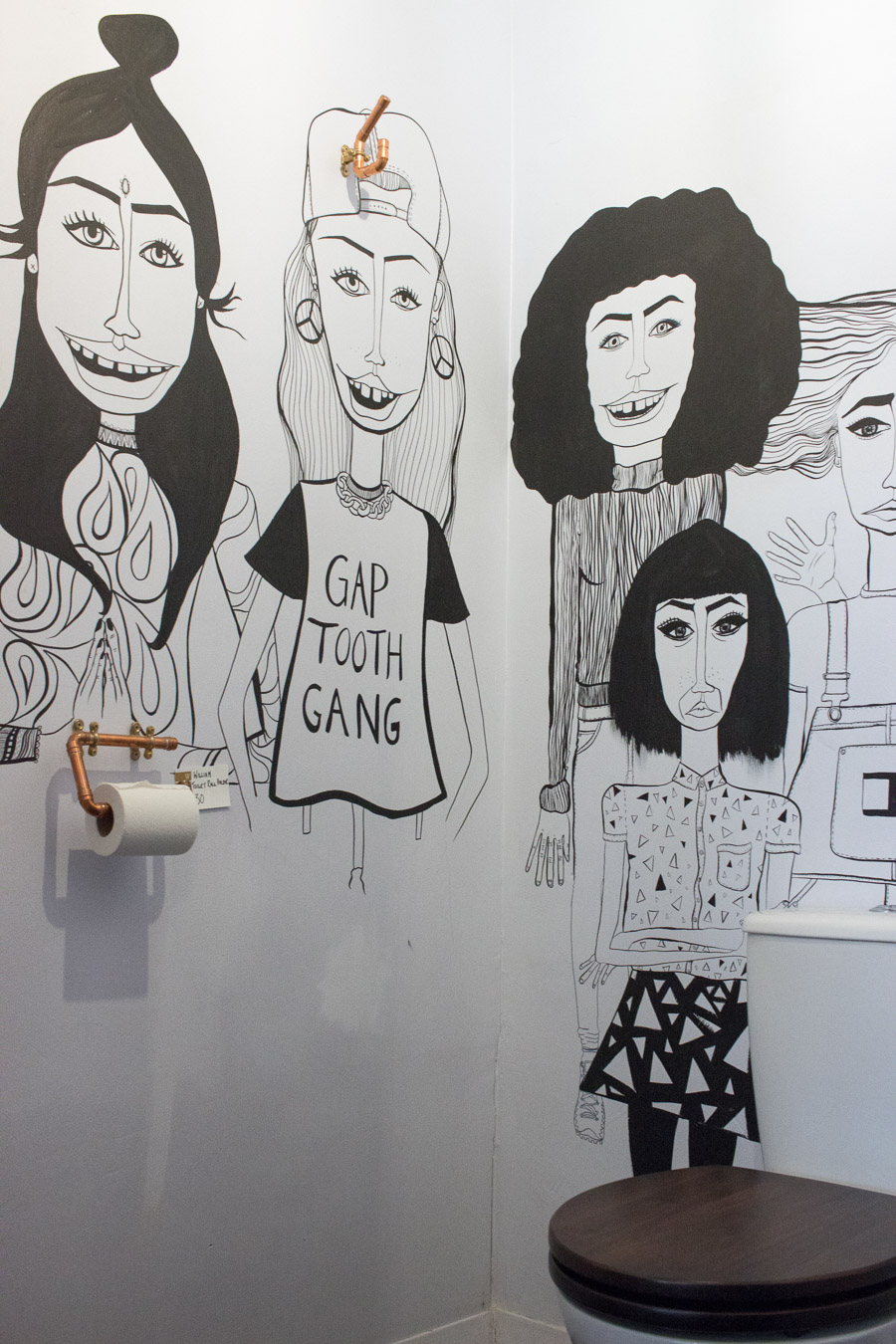 Freehand illustration by Jaqueline Fryers adorned the bathroom.
