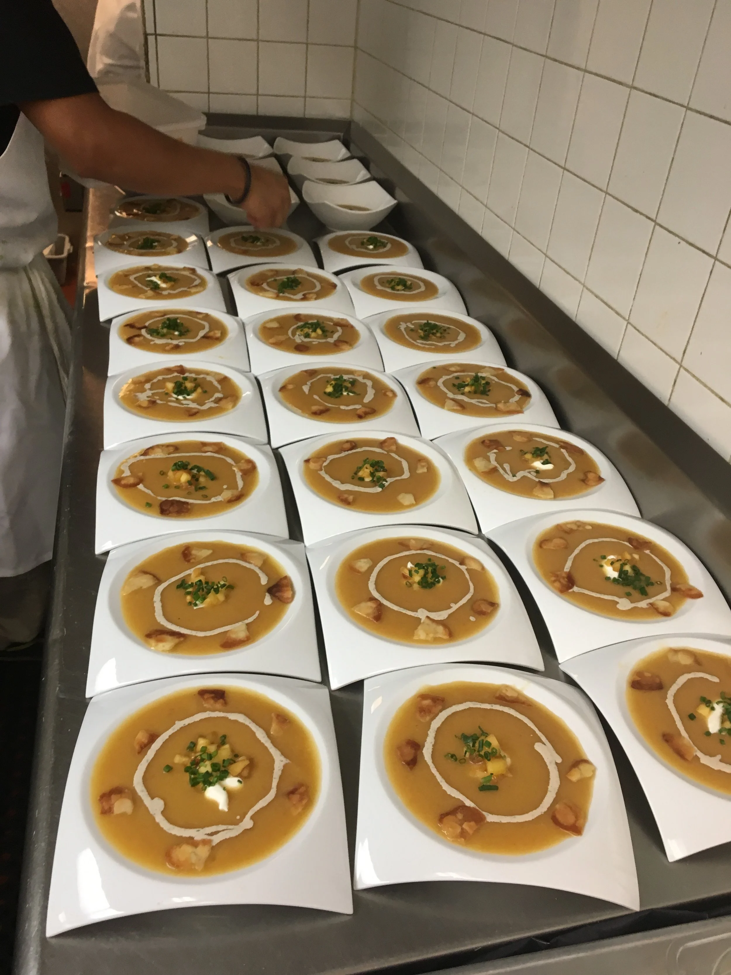 Peach and lemon grass soup Crème fraîche chive and mint drizzle