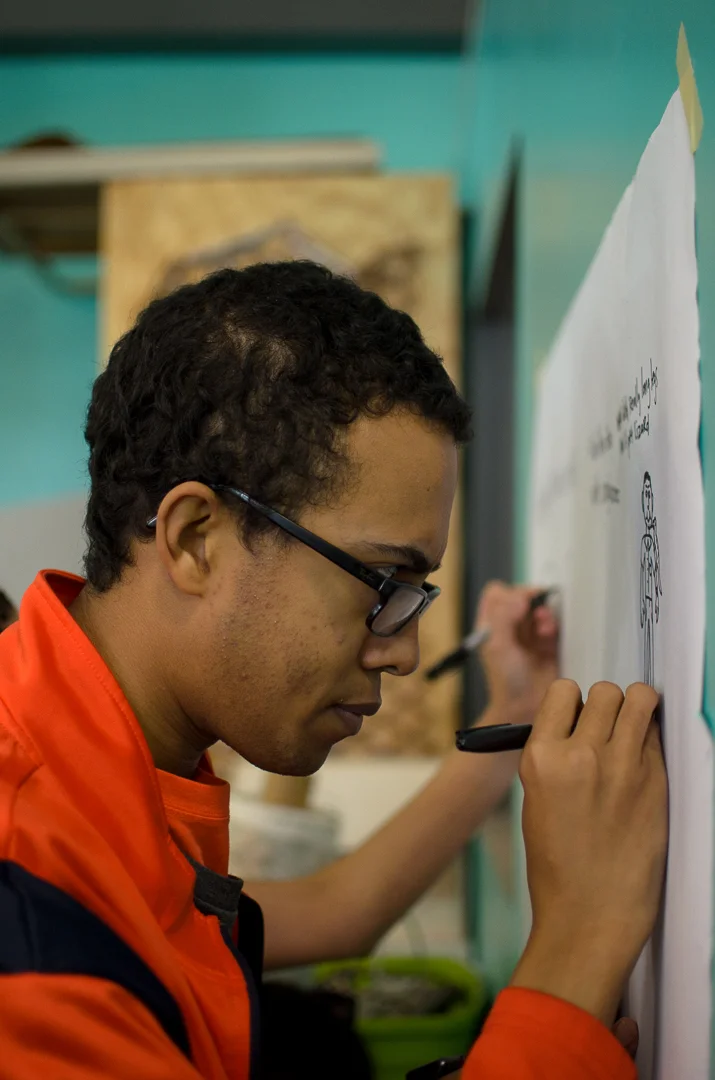 Artist drawing at Art Outside the Lines 