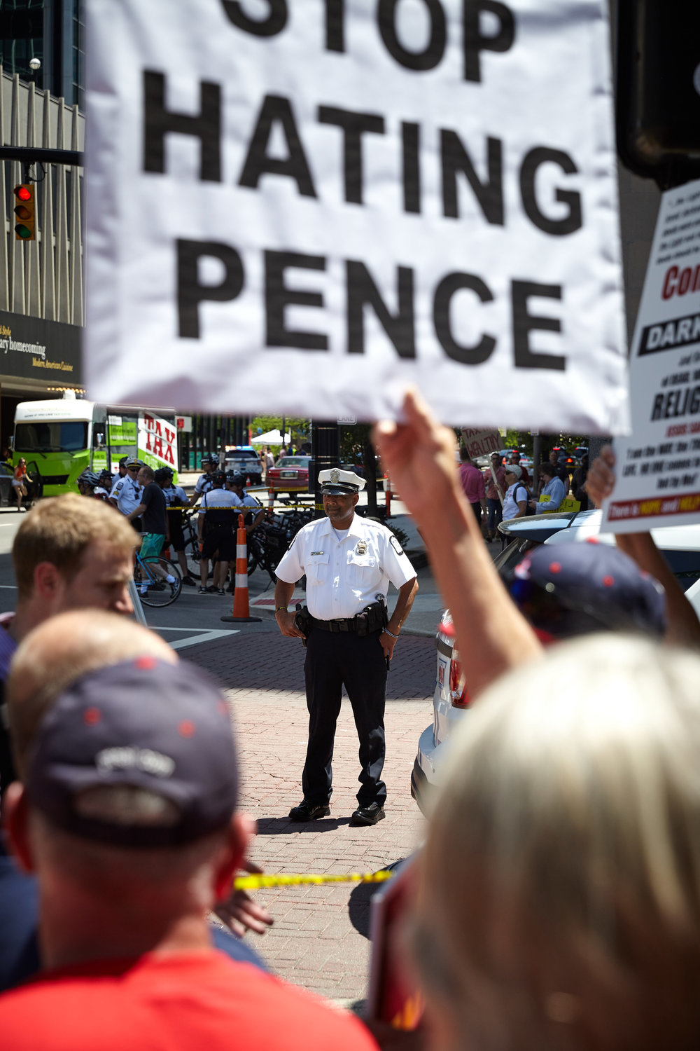 Police monitor a group of counter protesters adjacent to the Big Gay Dance Party