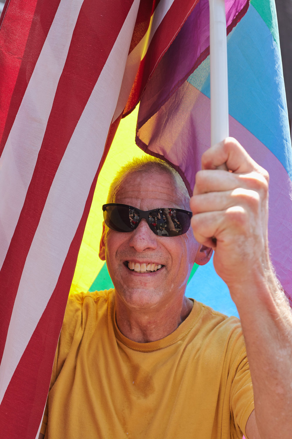 A Big Gay Dance Party attendee shrouded in flags.