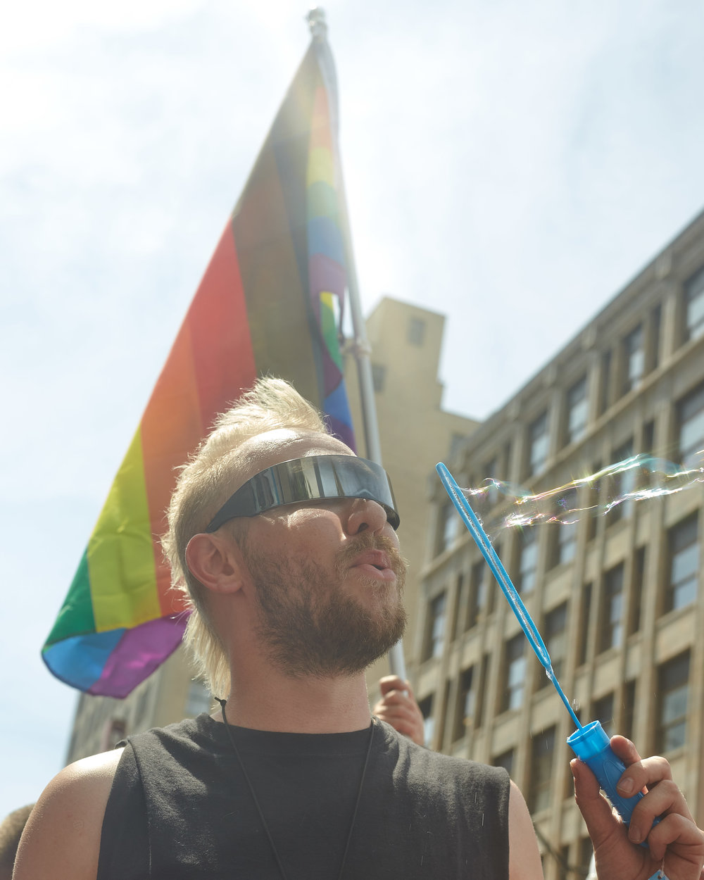 A Big Gay Dance Party attendee blows bubbles