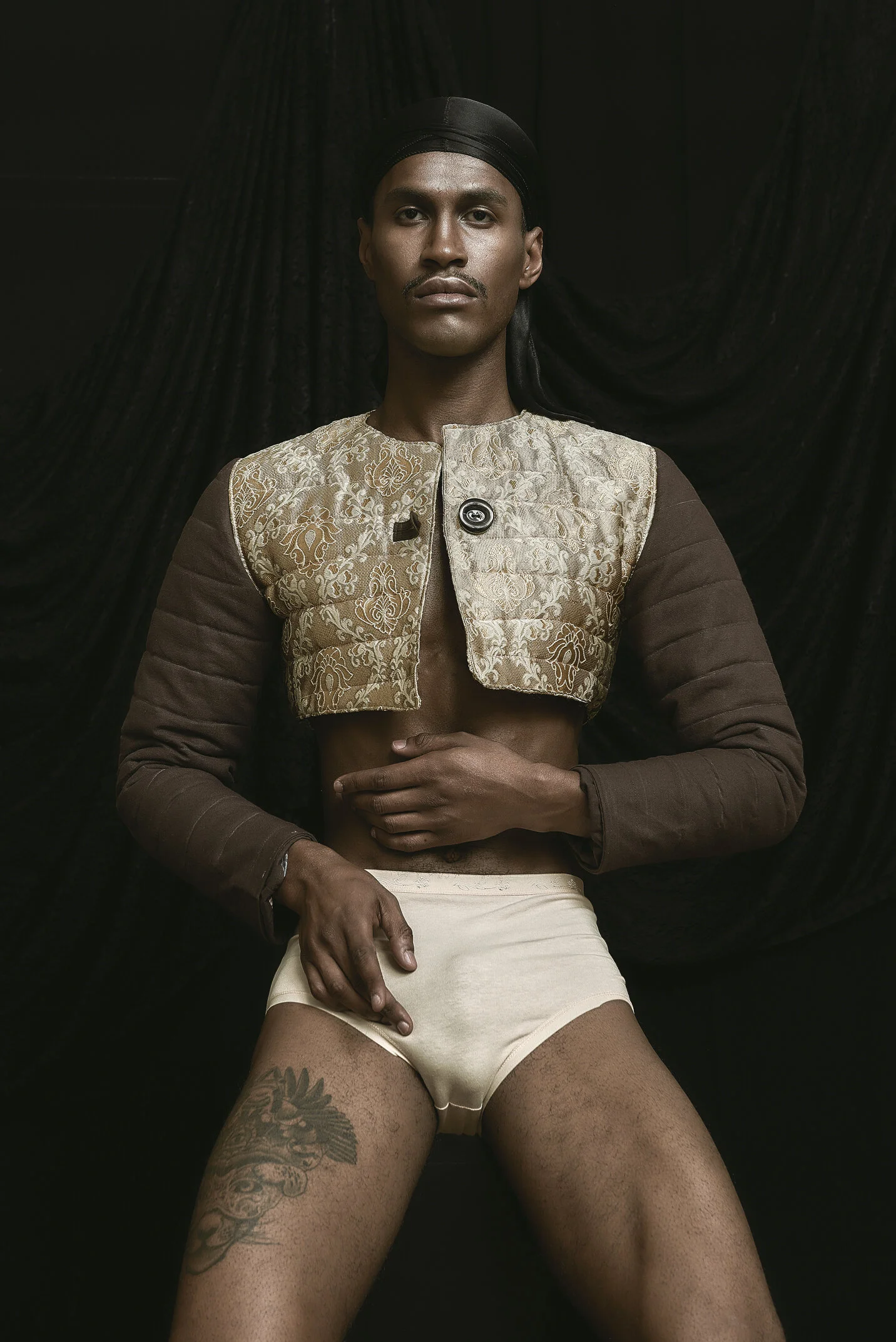 Gold brocato top jacket, with brown cotton-padded sleeves.