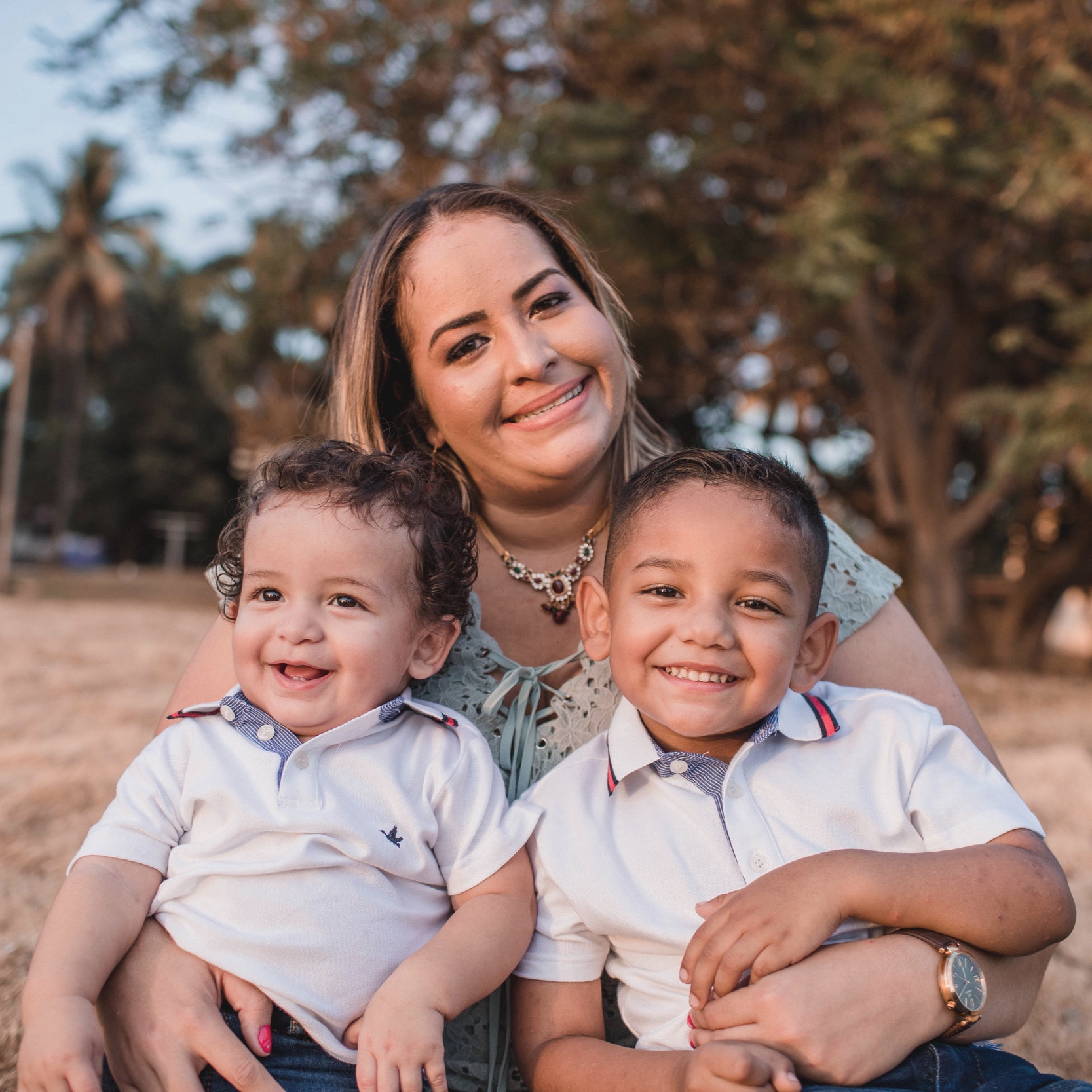 Canva+-+Woman+Holding+Two+Boys.jpg