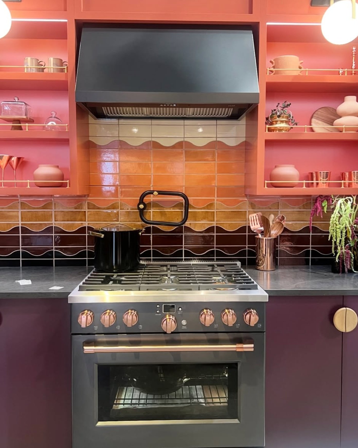 Colorful kitchen remodel by Cafe Appliances featuring Mercury Mosaics tile taken at KBIS by honeycomb Design and Build