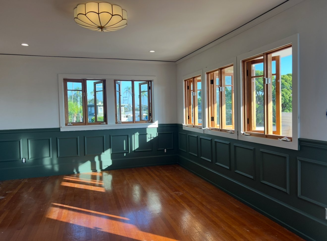 full home renovation with paneling and hard wood floors by Honeycomb Design and Build, mission hills remodeling contractor in San Diego