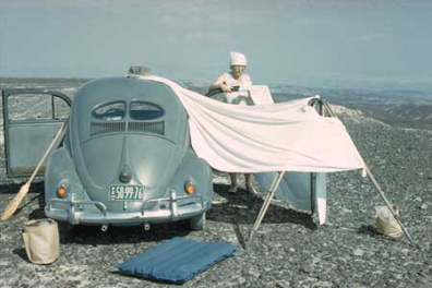 Maria Reiche in the 1960s with a Volkswagen and broom