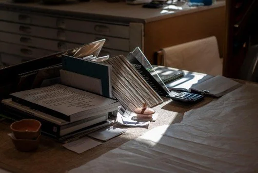 Organized business files and folders arranged on a desk | ProductiveandFree