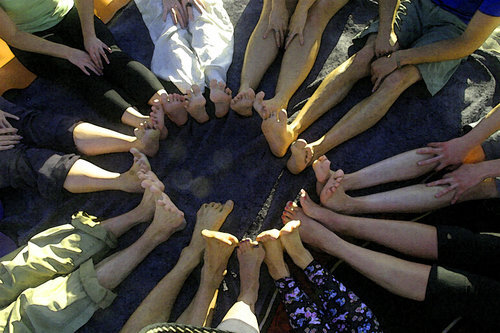  Children in a circle of feet 