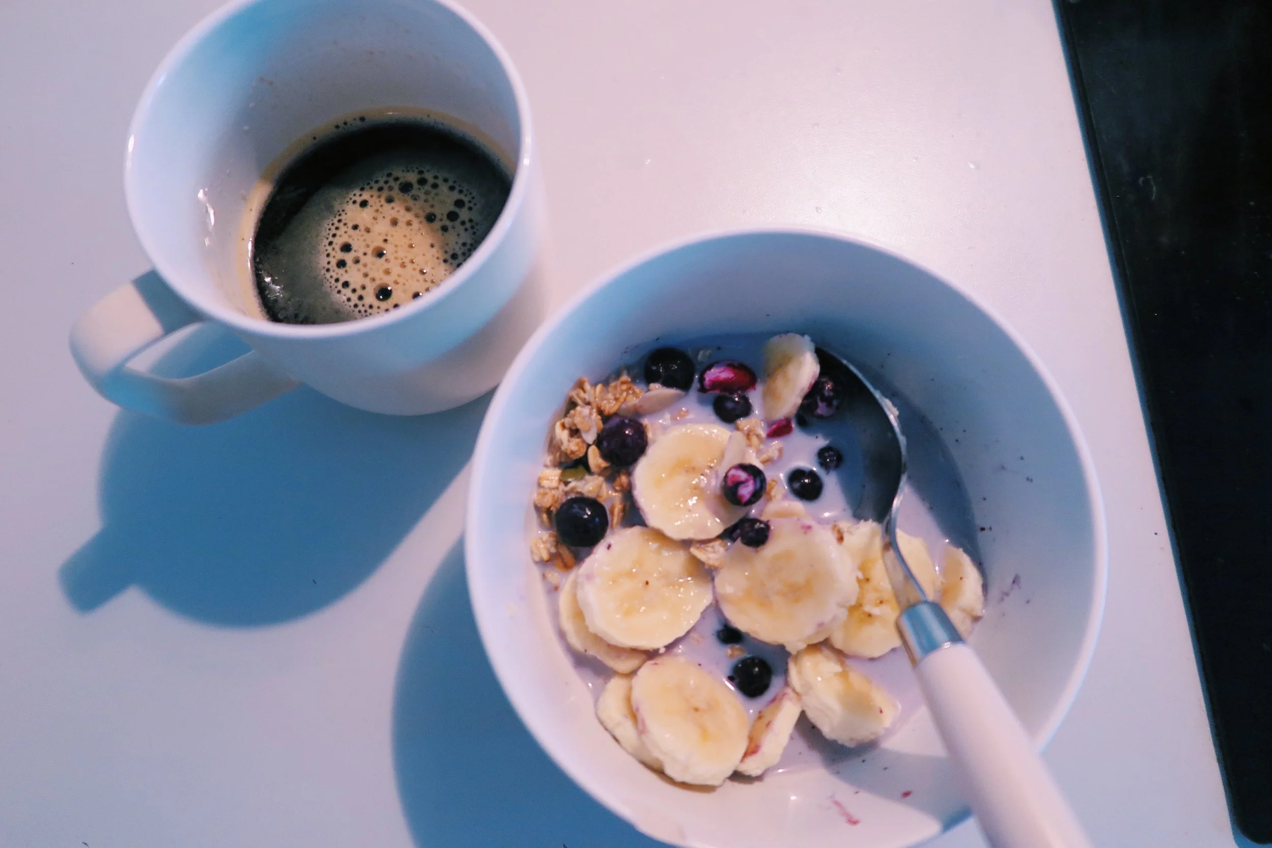 4. Super berry granola + soya milk + sliced banana + blueberries with black coffee