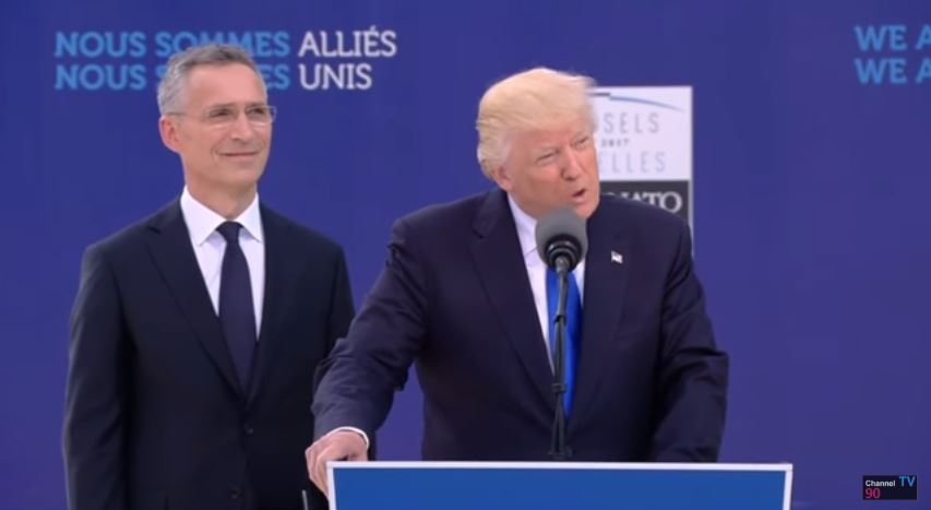 NATO General Secretary Jens Stoltenberg smiles after Trump says he didn't ask how much the new NATO headquarters cost.