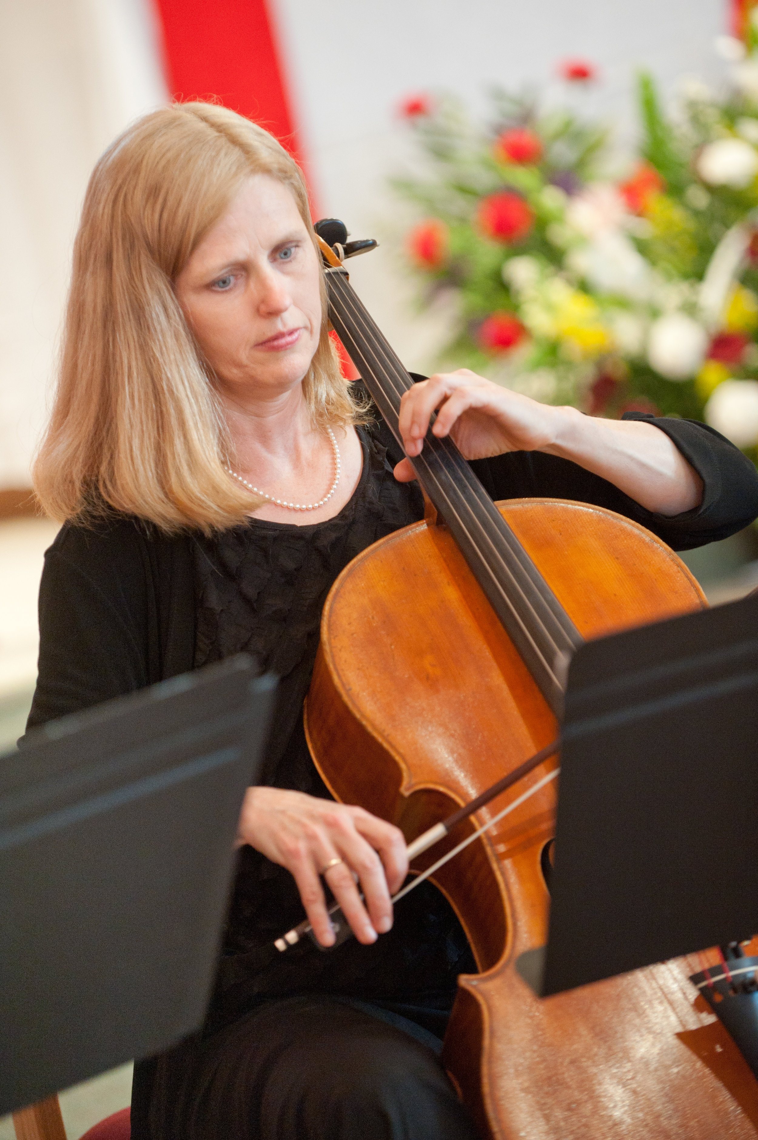 Kathy playing cello at a church event