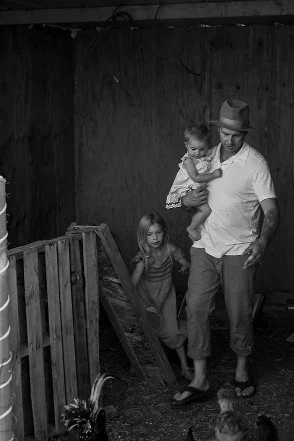 Family laughing in Kalama, Washington, at their home farm, photographed by Vancouver photographer Lillian Short.