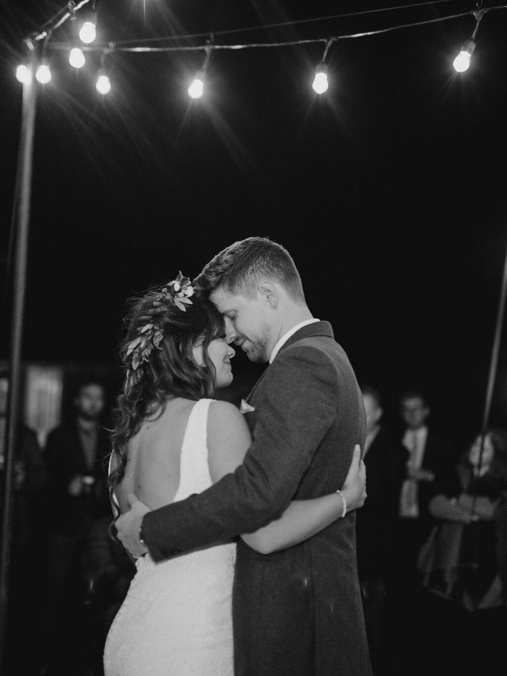 pacific-engagements-lake-crescent-lodge-wedding-reception-string-lights-bride-and-groom-first-dance-photos