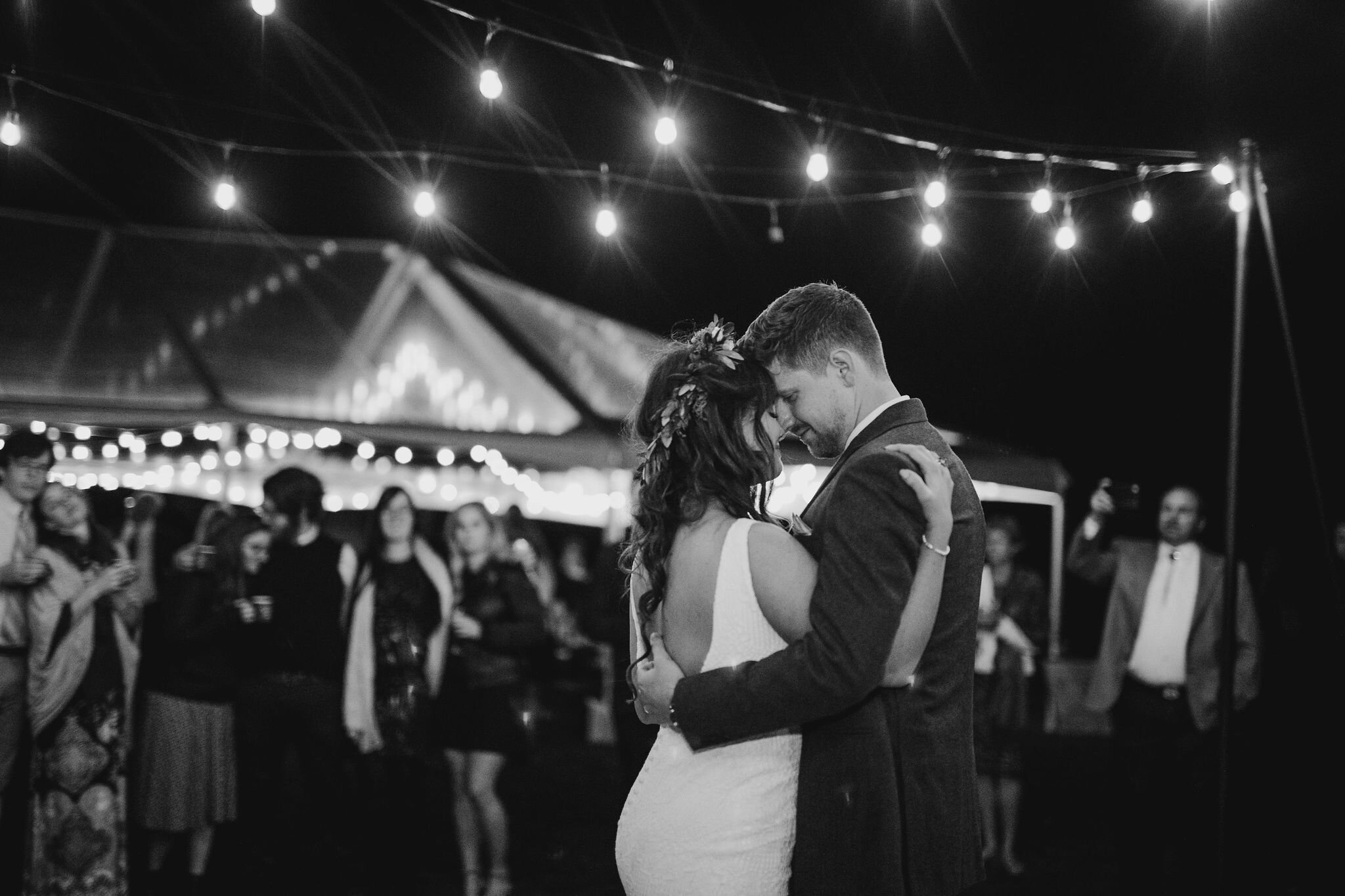 pacific-engagements-lake-crescent-lodge-wedding-first-dance-string-lights-wedding-reception-outdoor-bride-and-groom-romantic-wedding-photos