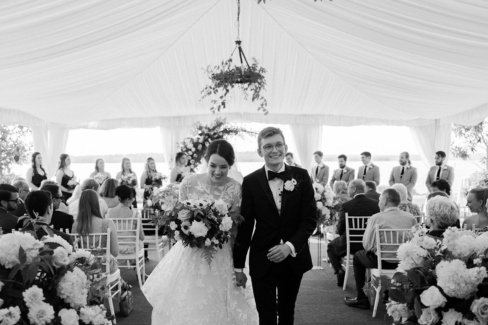 Woodmark-hotel-kirkland-wedding-pictures-of-bride-and-groom-walking-down-aisle-together-pacific-engagements-wedding-planner-seattle-photographer-anna-peters-photography