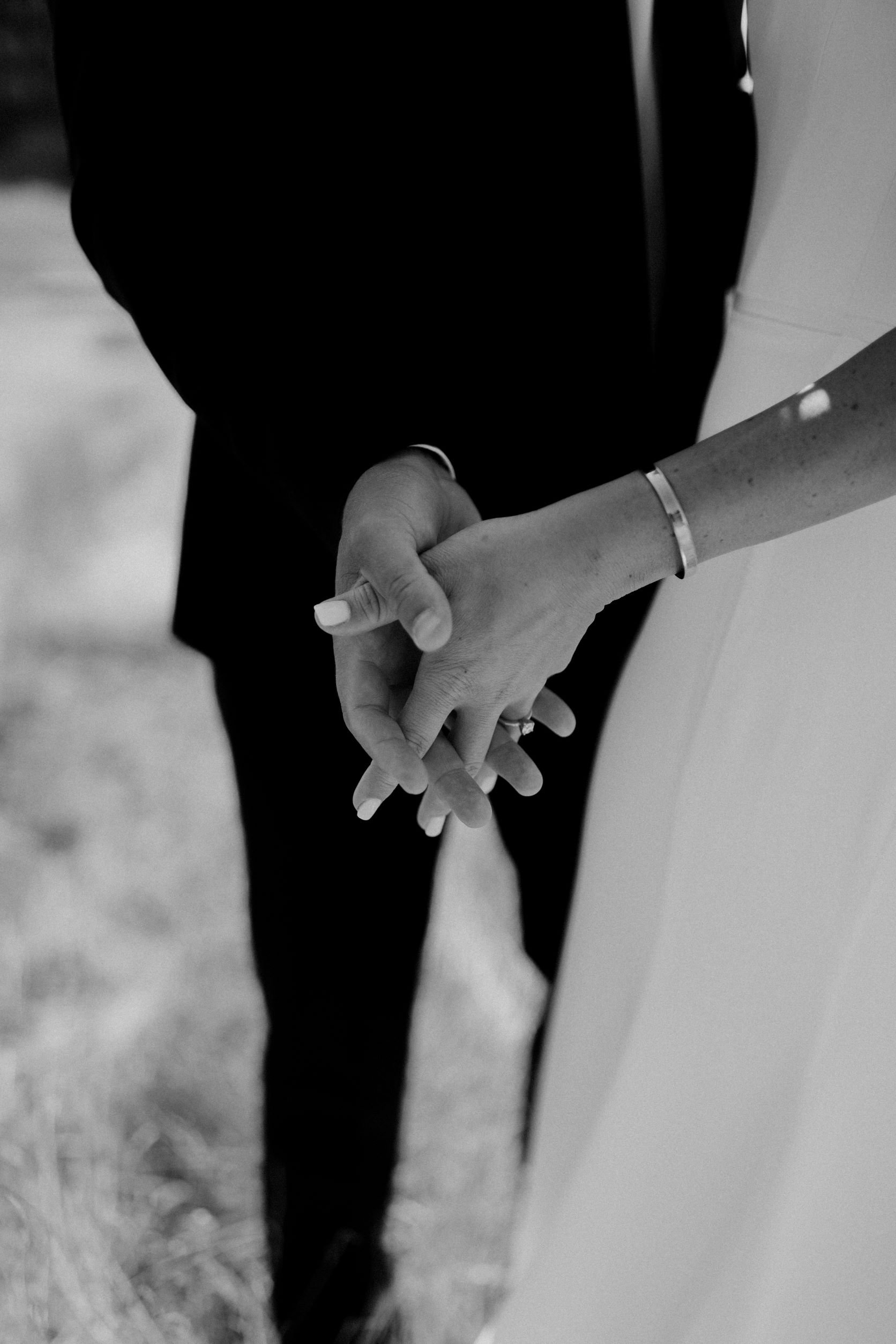 pacific-engagements-bride-and-groom-holding-hands-at-suncadia-resort-wedding-photos