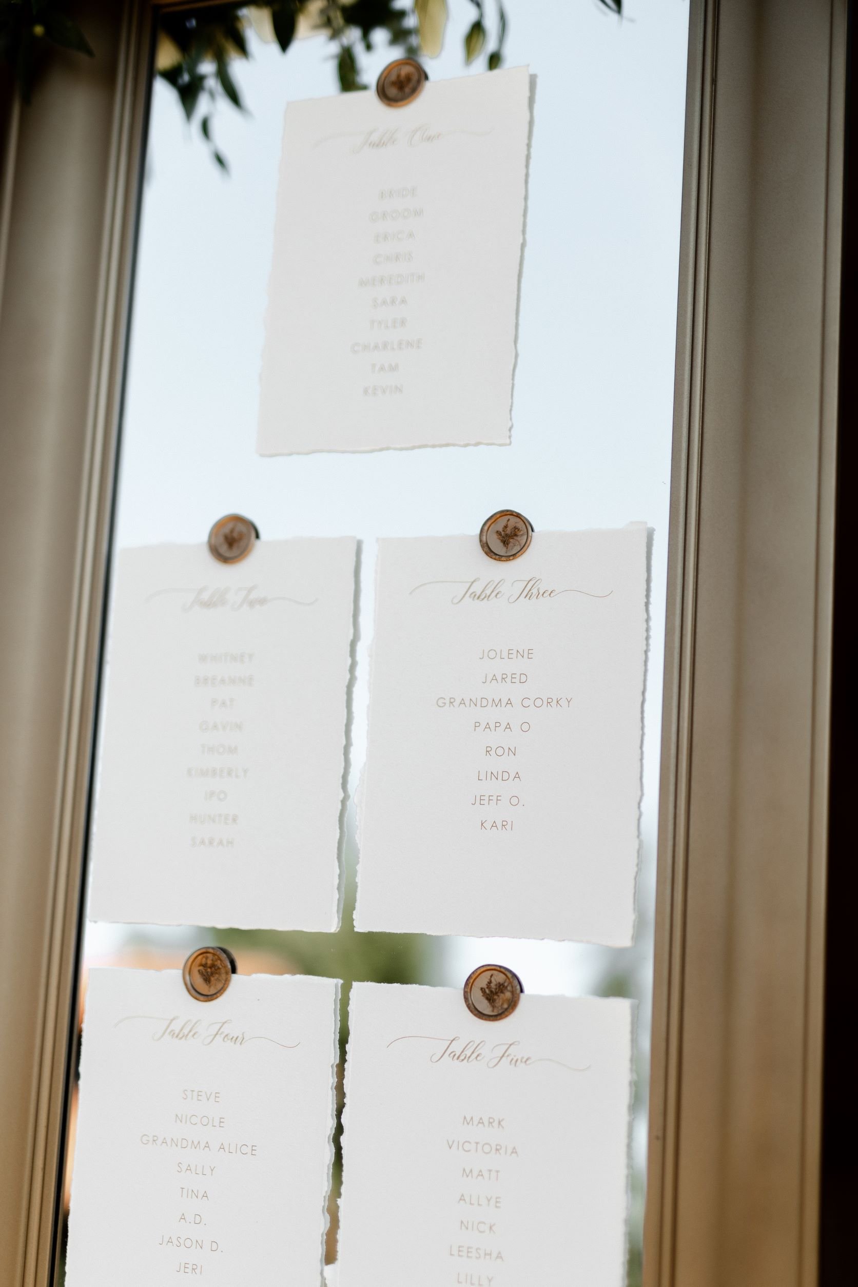 pacific-engagements-wedding-seating-chart-mirror-with-gold-wax-seals