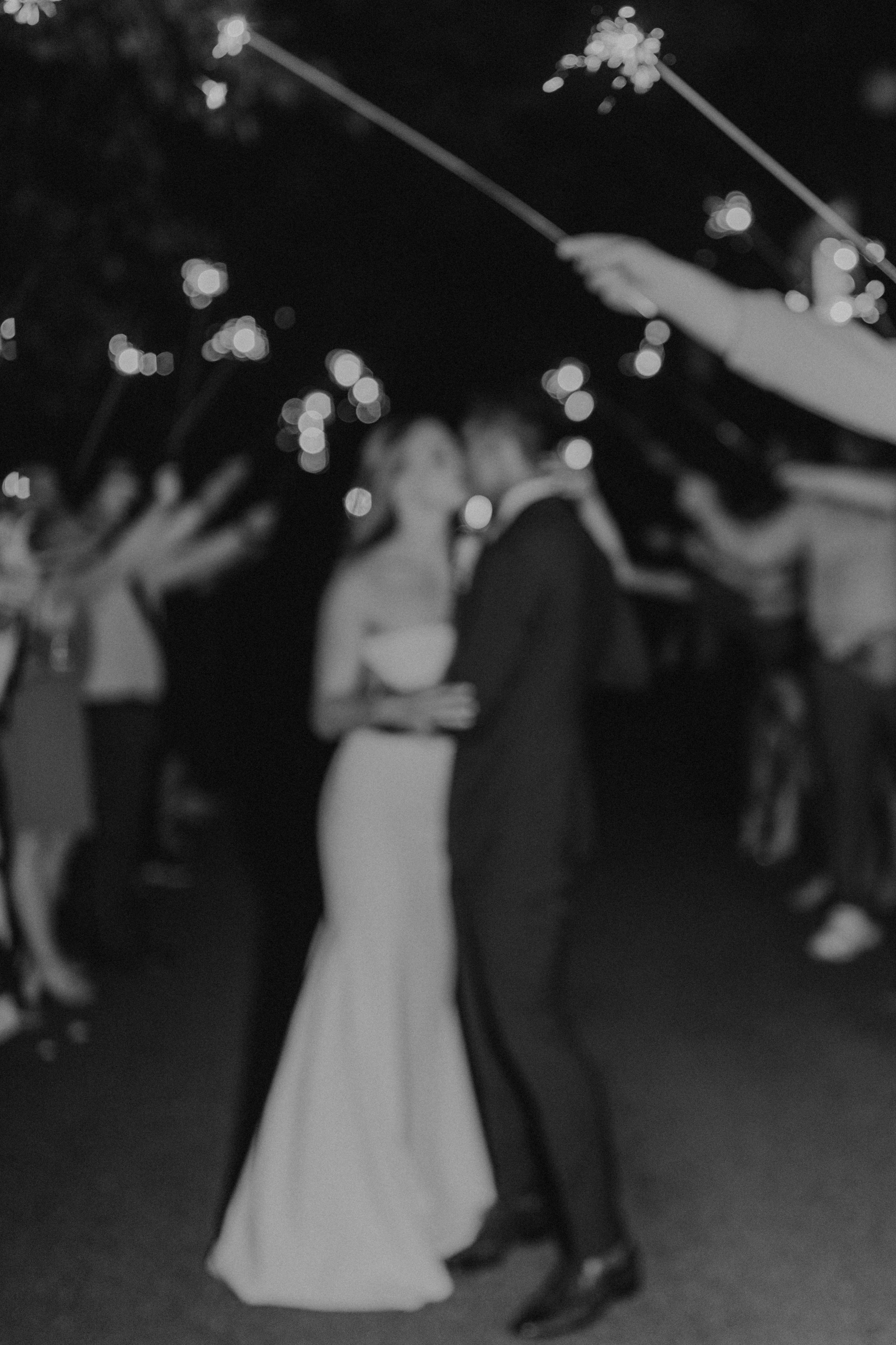 pacific-engagements-bride-and-groom-blurry-photos-of-sparkler-send-off-almquist-winery-wedding-rachel-syrisko-photography