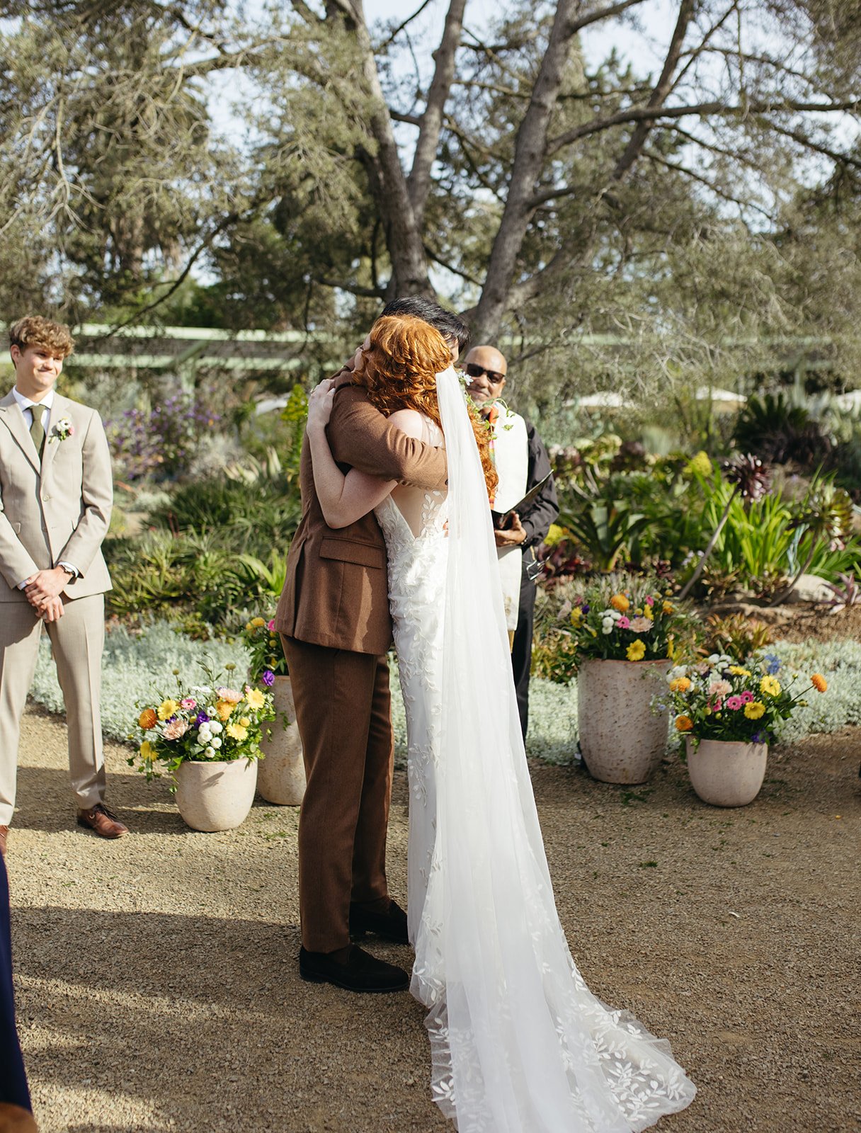 pacific-engagements-ruth-bancroft-gardens-wedding-photos-bride-and-groom-hugging-sam-minter-photography