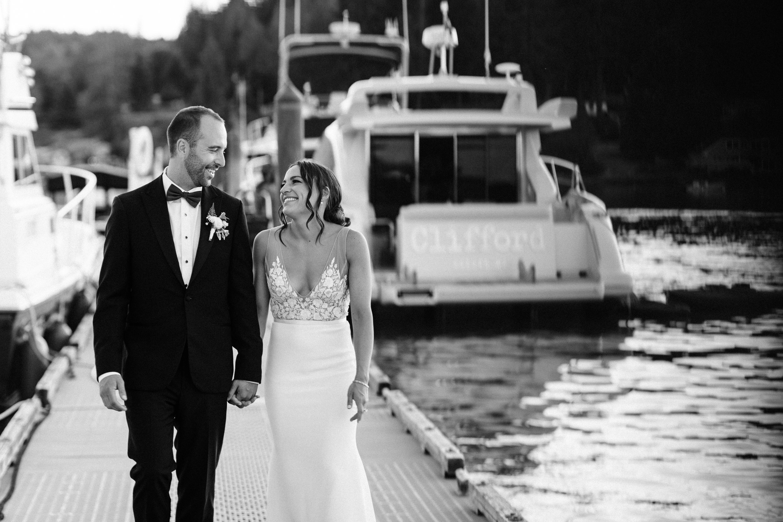 pacific-engagements-bride-and-groom-walking-on-alderbrook-resort-dock-hood-canal-union-wa-alexandra-grecco-real-brides