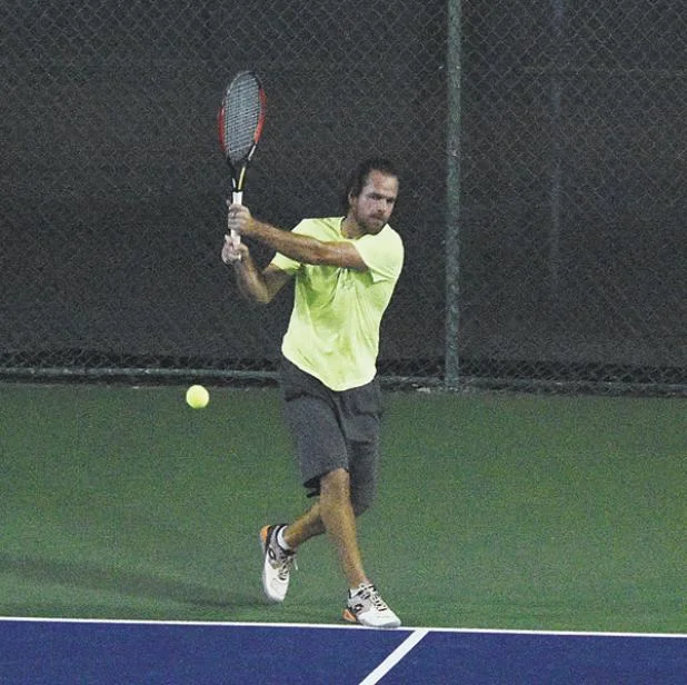 French Champion and former No.16 world ranked Xavier Malisse with a powerful return.