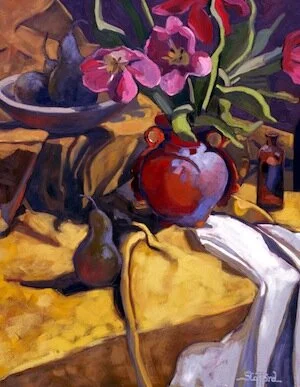 red tulips in orange vase
