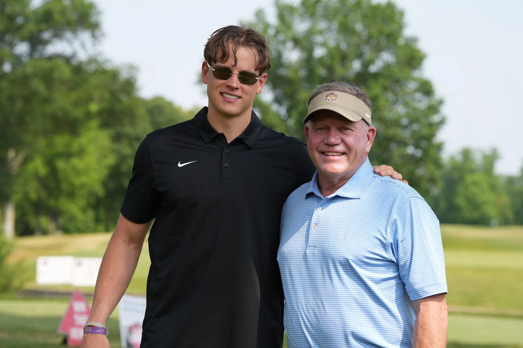  Joe Burrow poses with LSU Coach Brian Kelly during the Inaugural Joe Burrow Foundation Golf Invitational Monday, June 5, 2023 at Cold Stream Country Cub. 