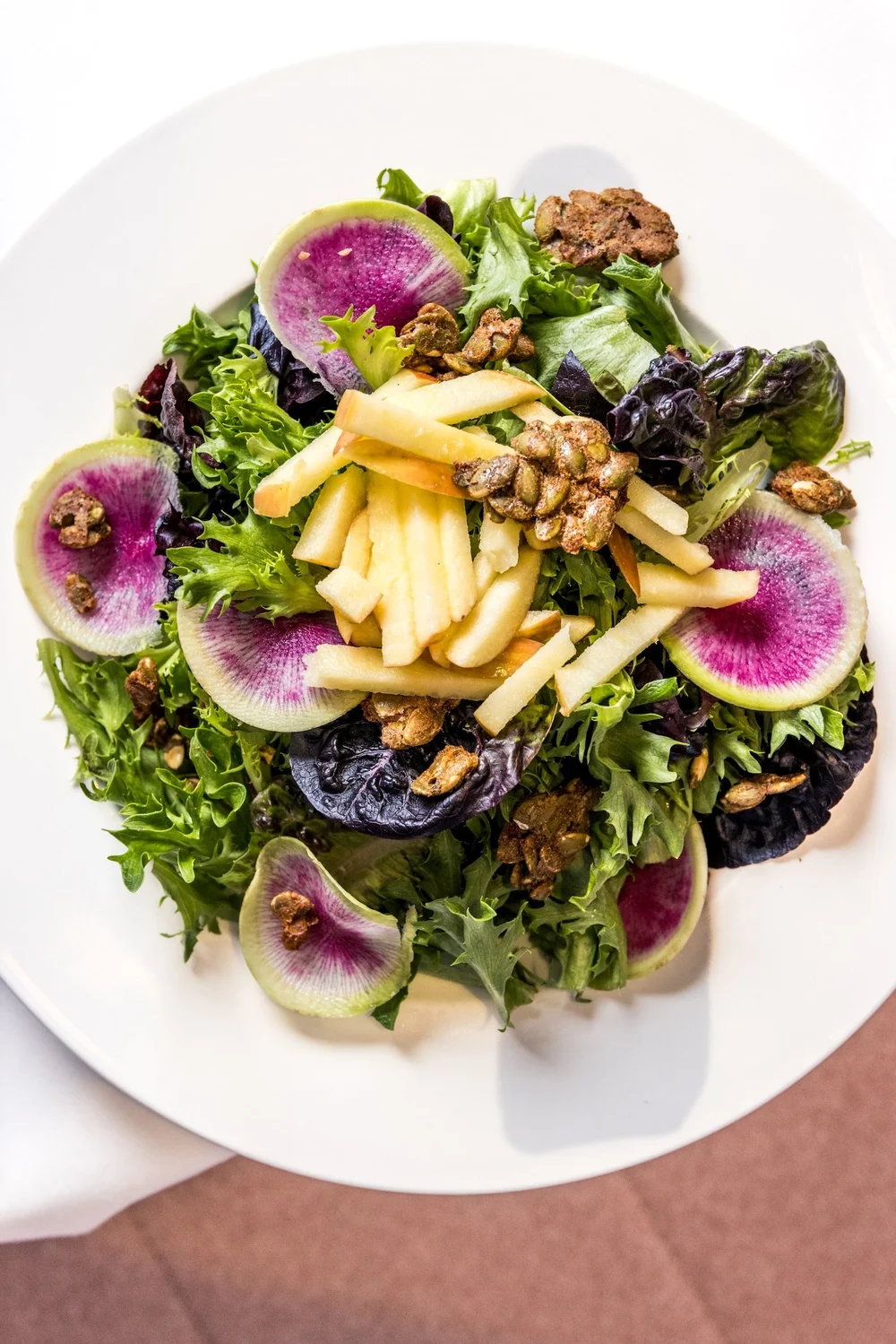  Apple Baum, $15  Greens, watermelon radish, candied pepitas, apple, apple cider vinaigrette 