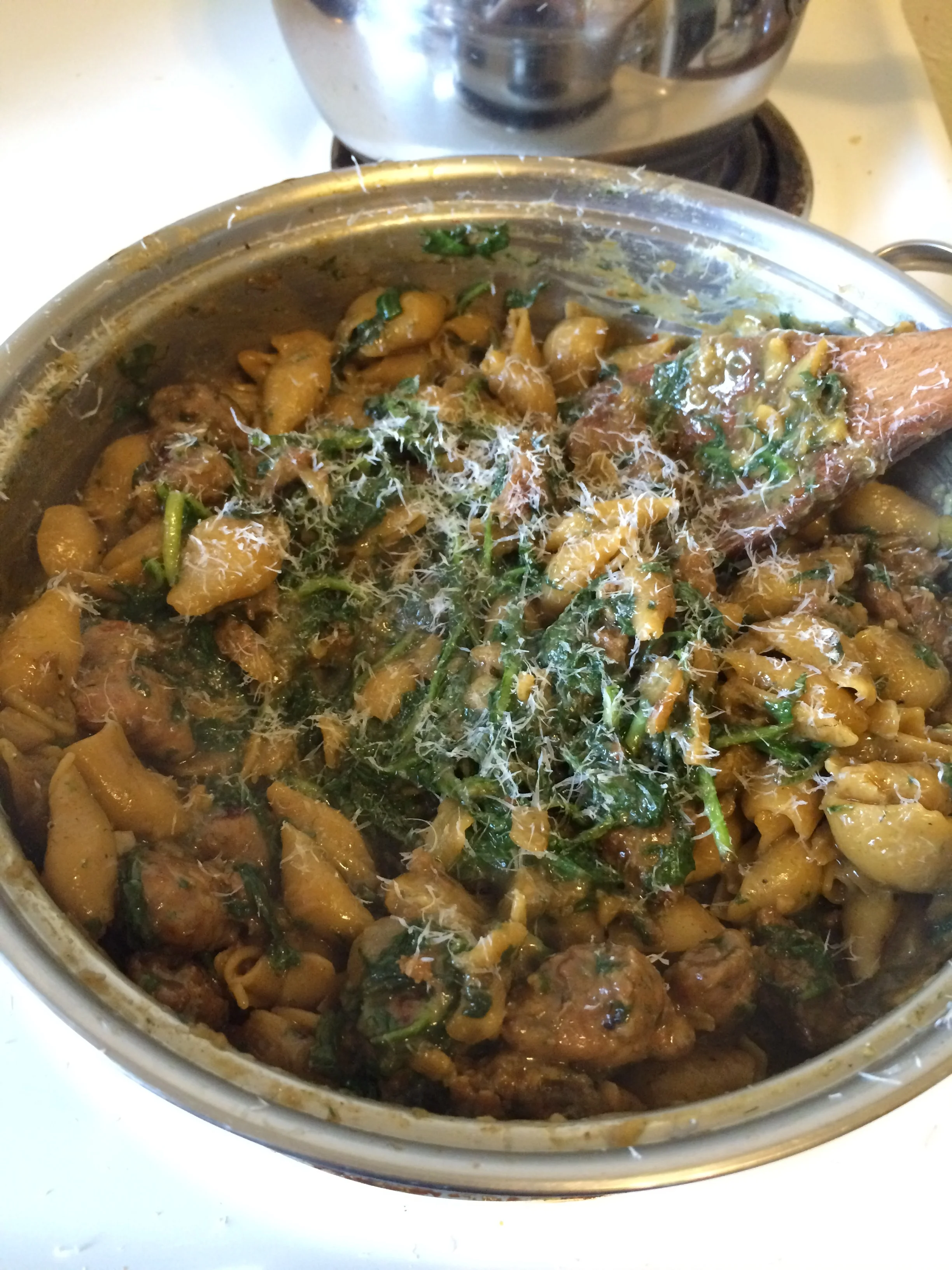  Italian sausage and arugula pasta with parmigiano reggiano. 