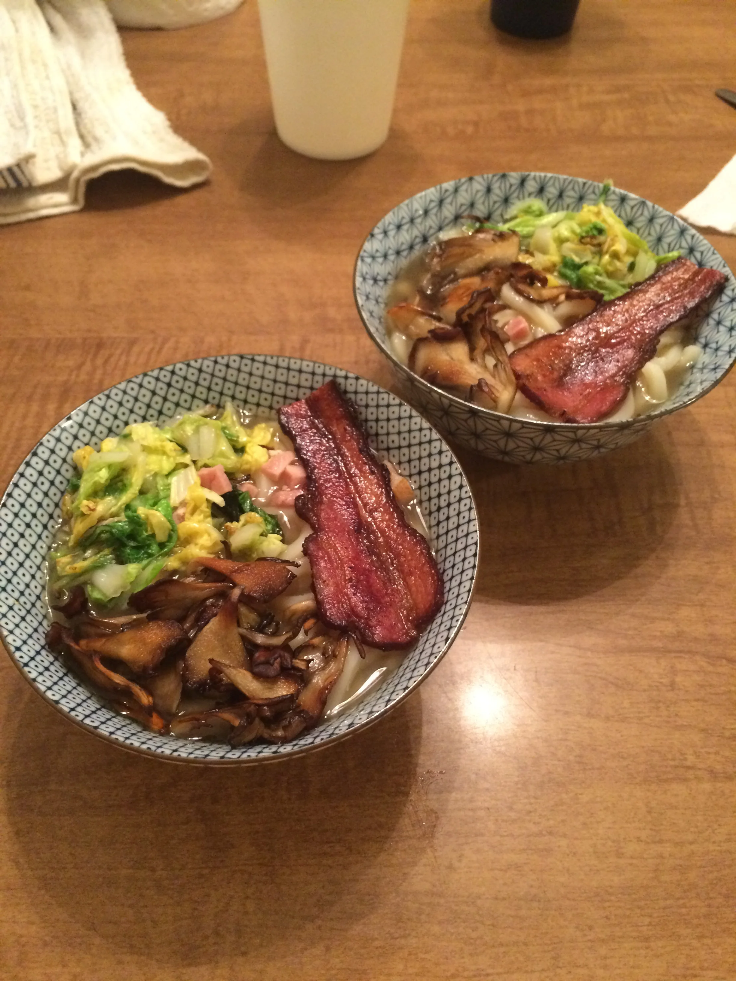  Udon noodles in chicken broth with napa cabbage, mushrooms, and pork belly. 