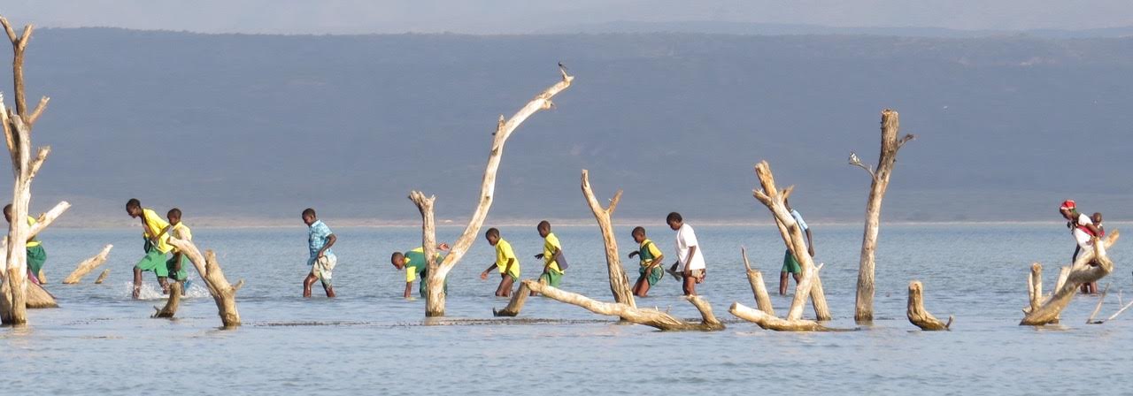 Students cross the lake on their way home from Kokwa Primary School 