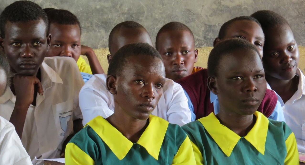 Secondary scholarship recipients listen to career advice at a workshop with NECOFA