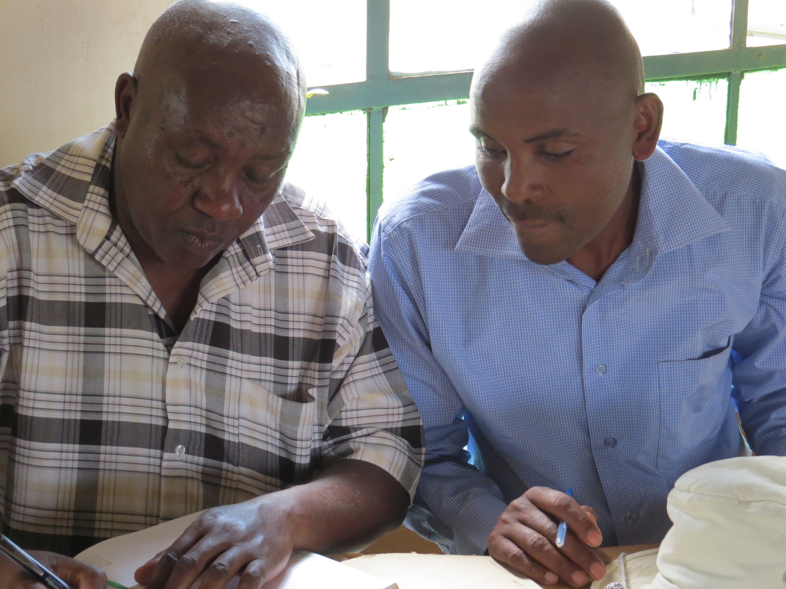 Samuel Muhunyu and Head Teacher Samuel Mutabari conferring