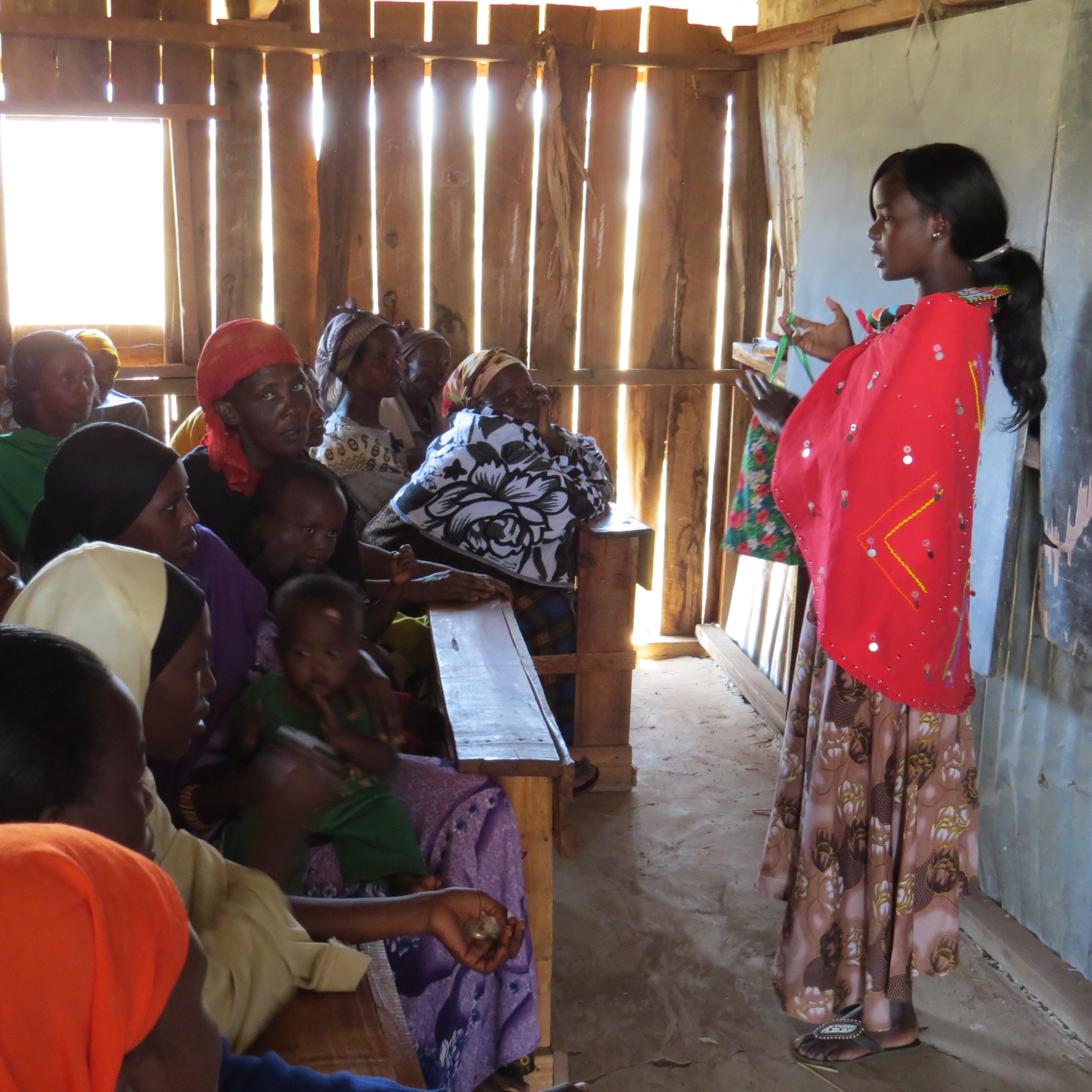 Irene Lechingei teaching students and their moms about Days for Girls hygiene kits