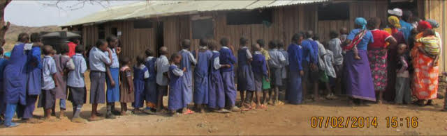 Residents line up to see the doctors at a medical camp in 2014