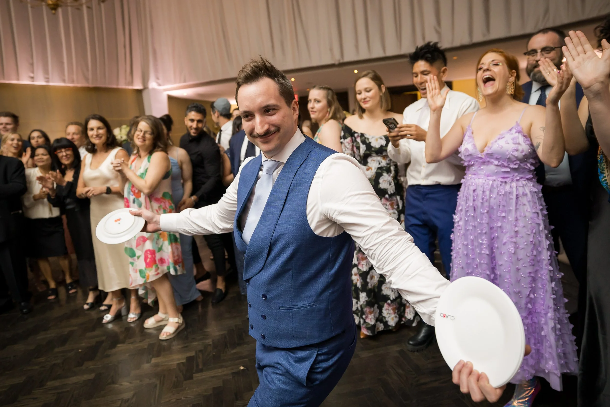 groom dancing and smashing plate
