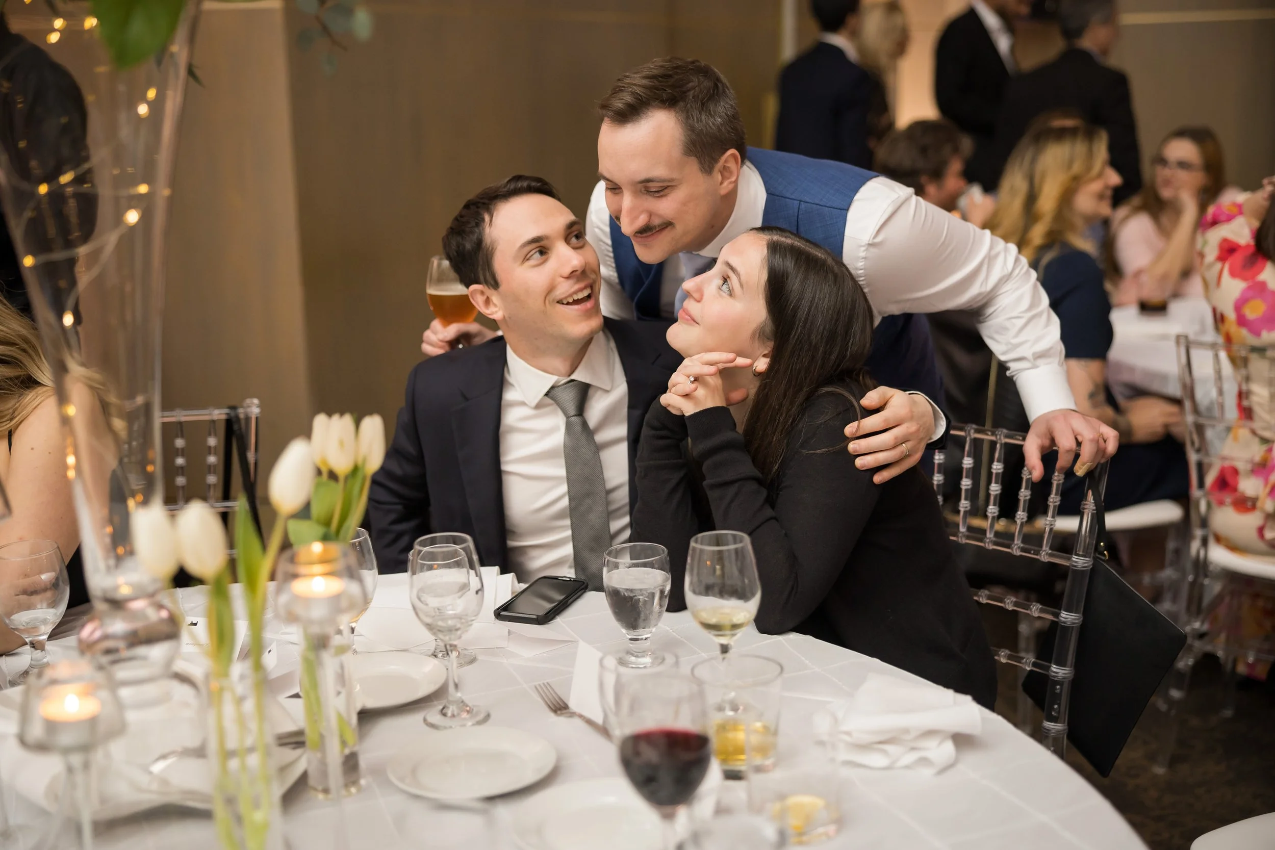 Groom interacting with guests at wedding