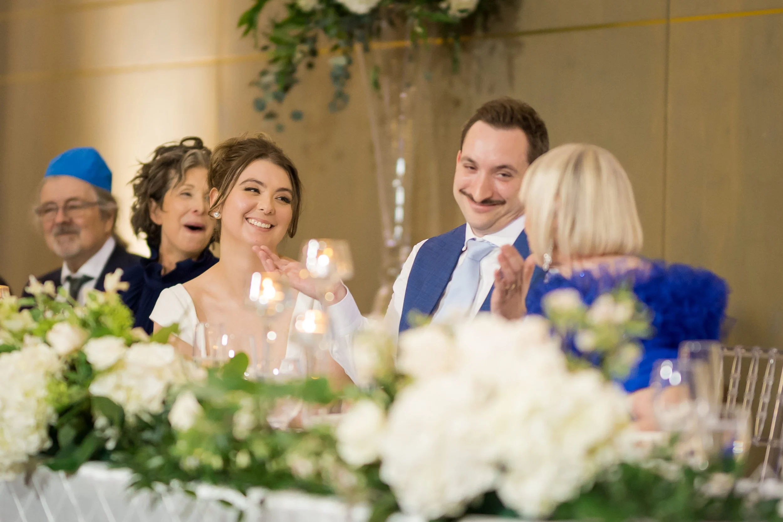 bride and groom laughing during speeches