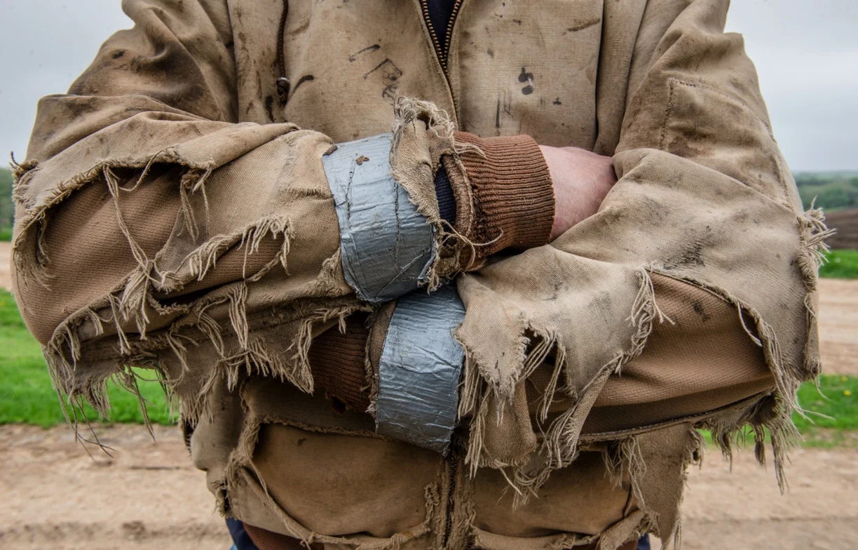 A tattered carhart jacket continues to work long after it has been broken in. (Photo: Joseph L. Murphy