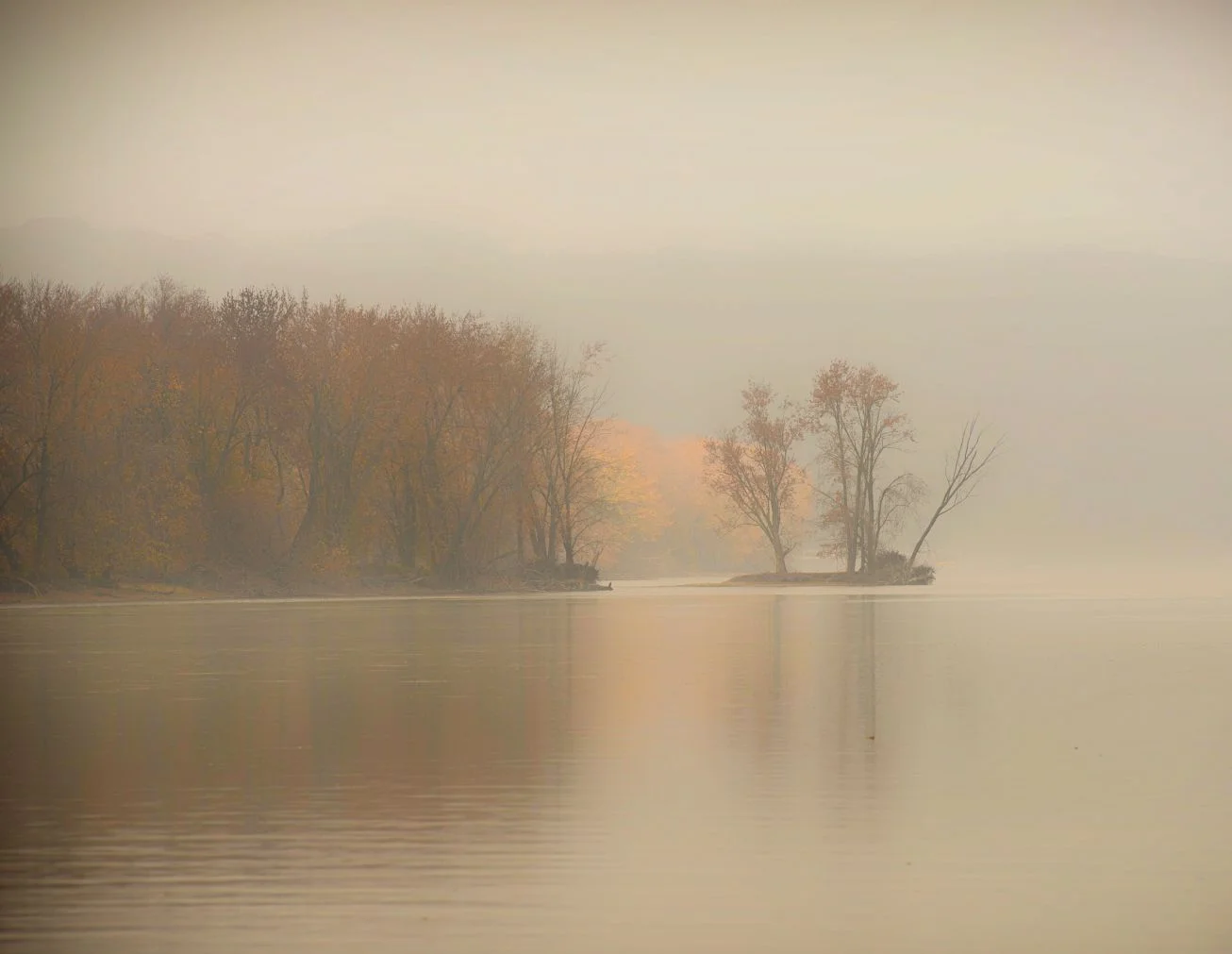 A bank of fog begins to lift on the Mississippi River near Prairie Du Chien, Wisconsin.