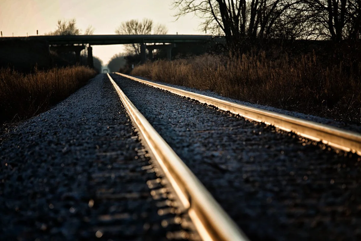 The sun illuminates railroad tracks in southern Iowa.