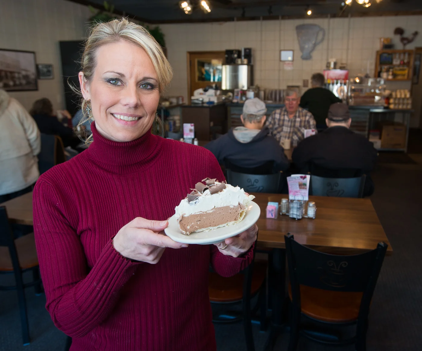 Robin Morvant holds a slice of pie at the Coffee Cup Cafe in Sully, Iowa. Morvant and her husband own the cafe has been named one of the best places for pie in the U.S. (Photo: Joseph L. Murphy)