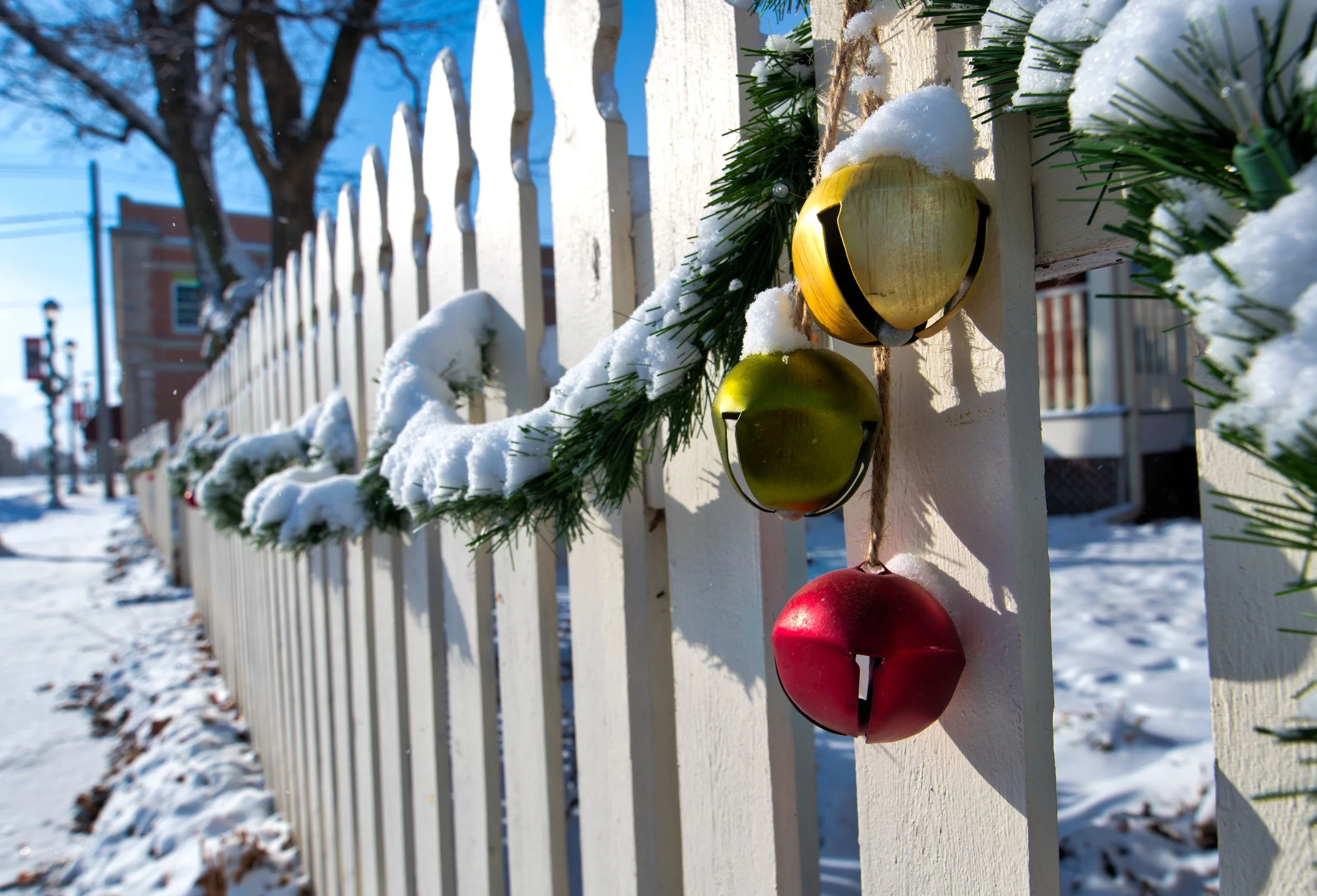 A fresh blanket of snow covers the sidewalks and garland lining a wooden fence near the Winterset town square the day before Christmas. Many Iowan's had a white Christmas after a light storm moved across the state dropping an inch to two-inches of s…