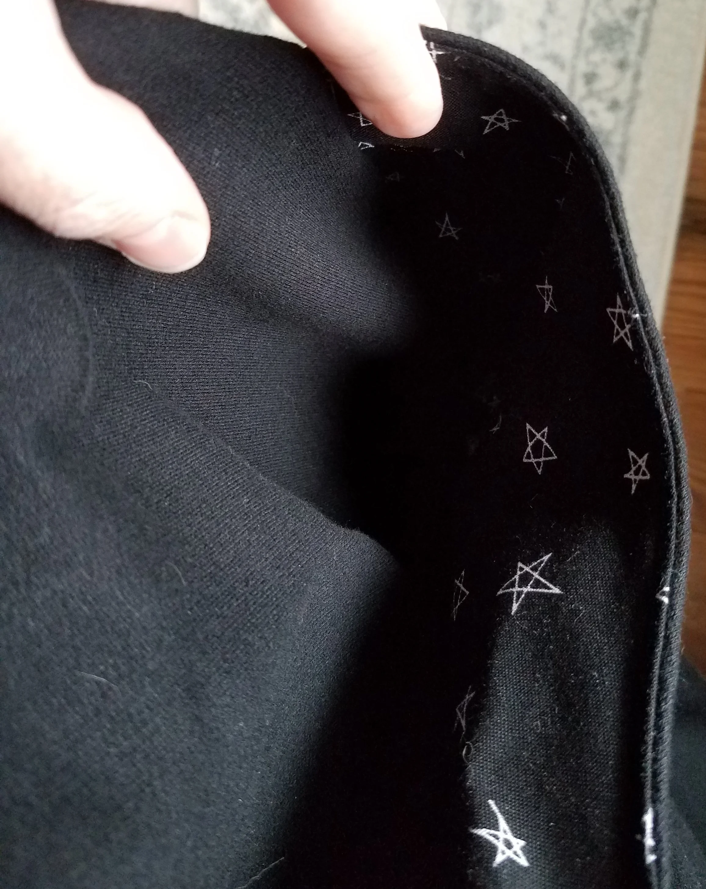Peeking in one pocket. There's those stars.